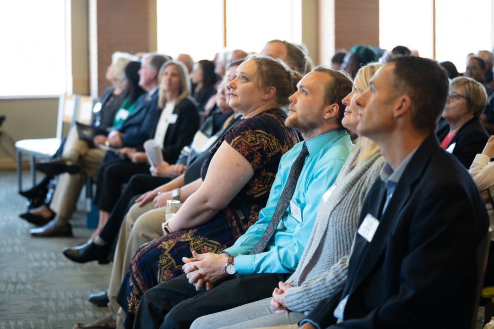 Guests watching a speaker at the Lynn M. Blue Connection Naming Ceremony